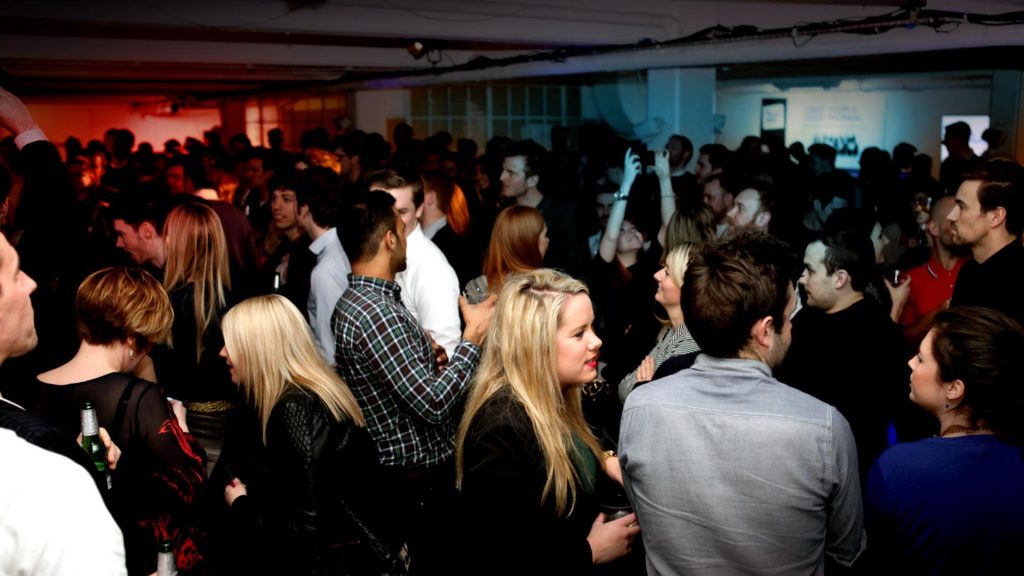 Crowd at event mingling.